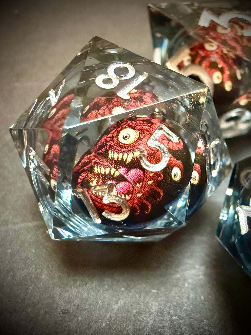 Red Beholder Rotating Core Resin Dice Set