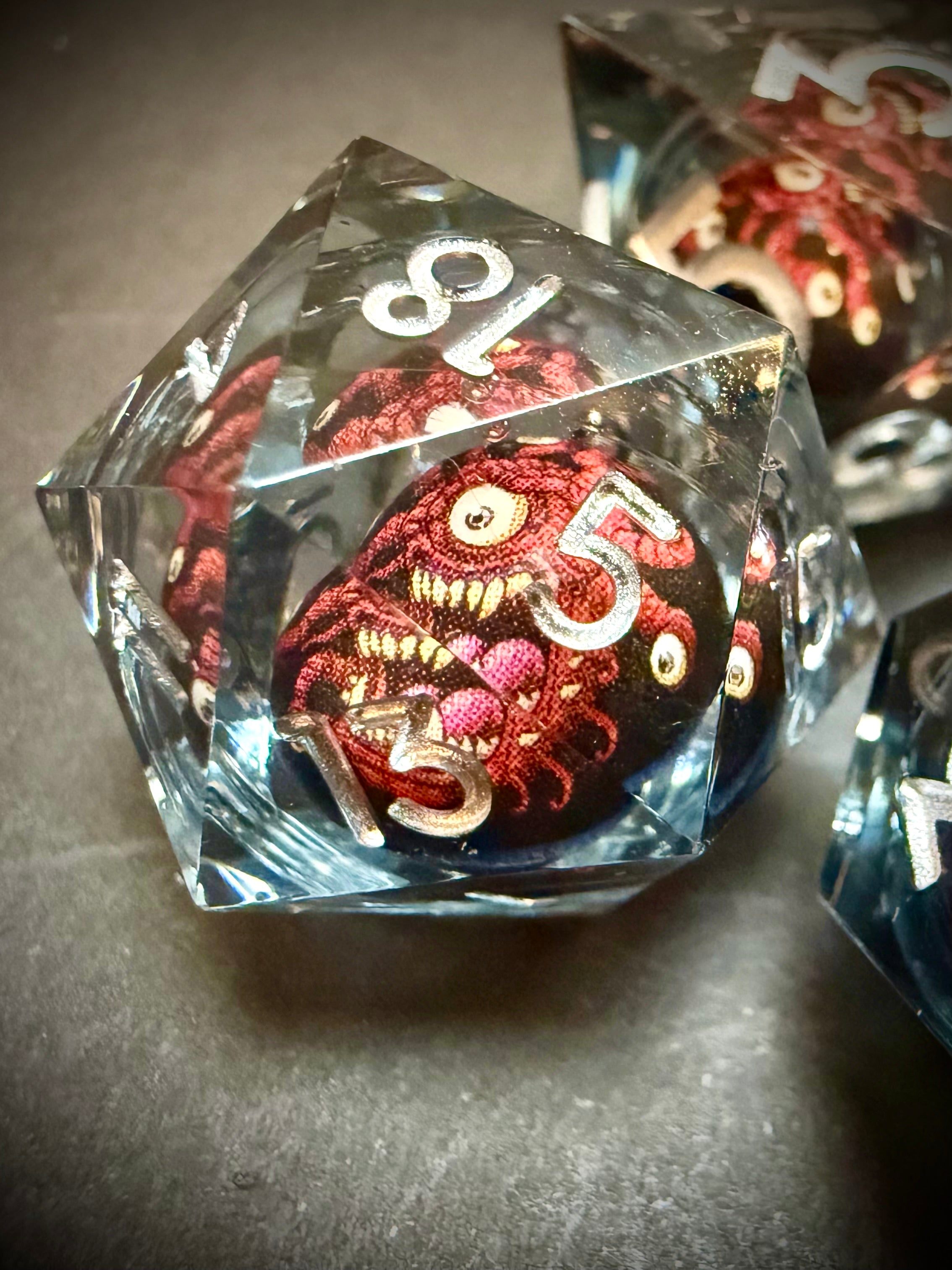 Red Beholder Rotating Core Resin Dice Set